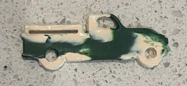 Old truck with bed rails painted cream and dark green gloss