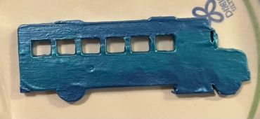 School bus painted two shades of metallic blue