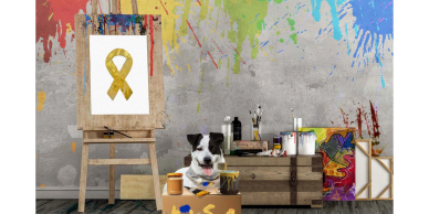 A dog with painting supplies in a colorful artist's studio.