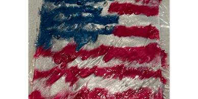 American flag made with paint on a textured surface.