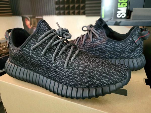 Pair of black and gray athletic sneakers with textured soles.