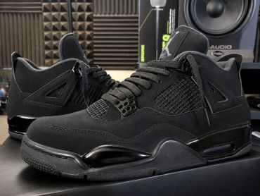 Sleek black Air Jordan sneakers displayed indoors.