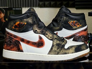 Custom-designed Air Jordan 1 sneakers with fiery and textured details.