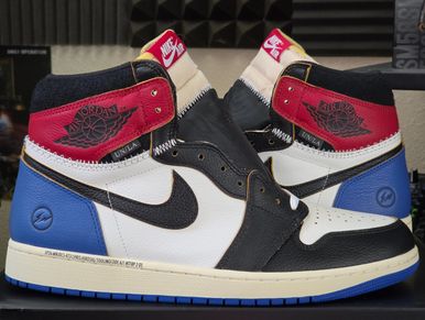 Colorful Air Jordan 1 sneakers with red, blue, black, and white panels.