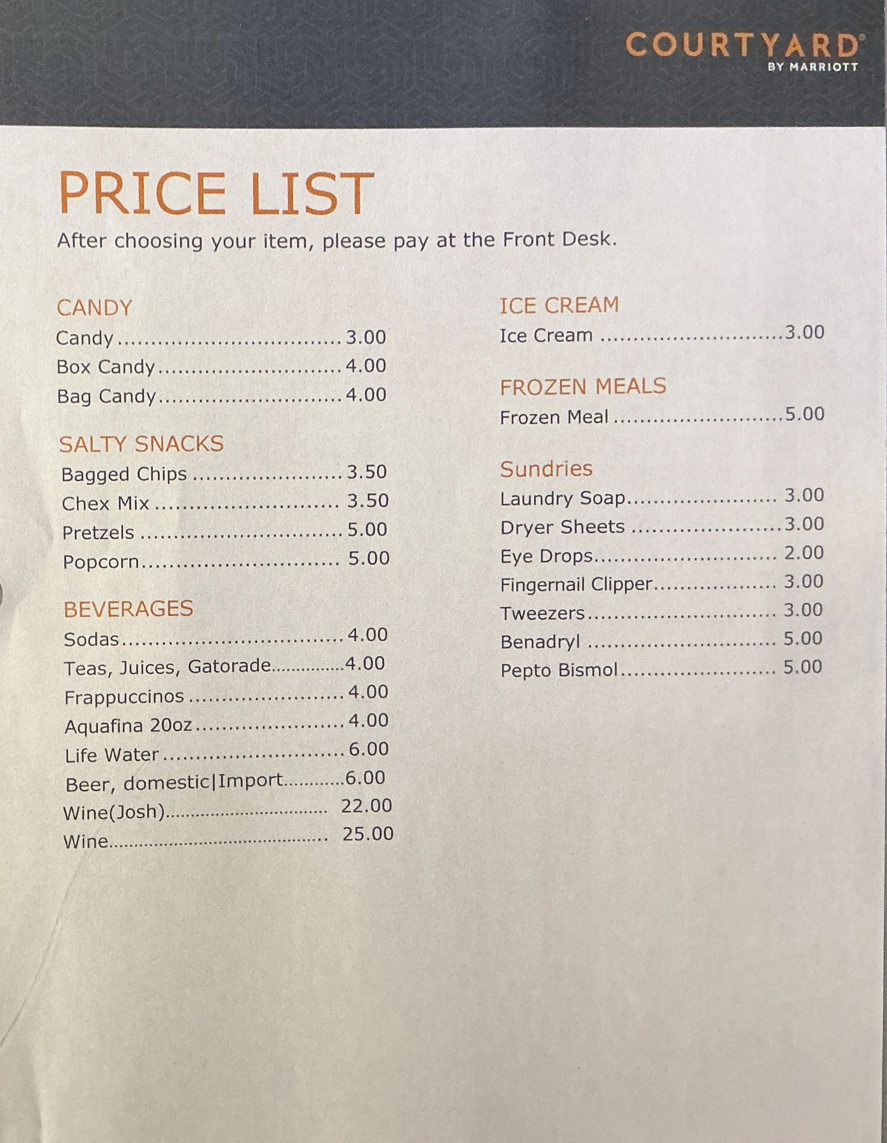 Price list of snacks, beverages, ice cream, frozen meals, and sundries at Courtyard by Marriott.