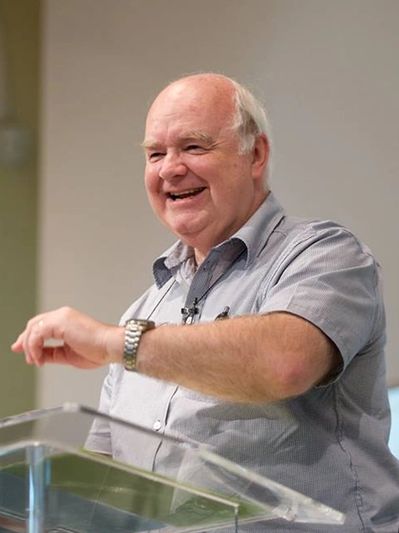 Always happy, John Lennox during an Apologetics speaking engagement. 