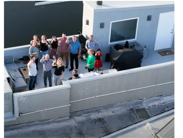 Drone proposal photography captured this group of people for the Philadelphia rooftop proposal. 