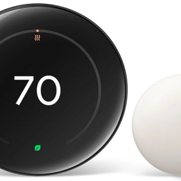 Smart thermostat displaying 70 degrees with a sleek design.