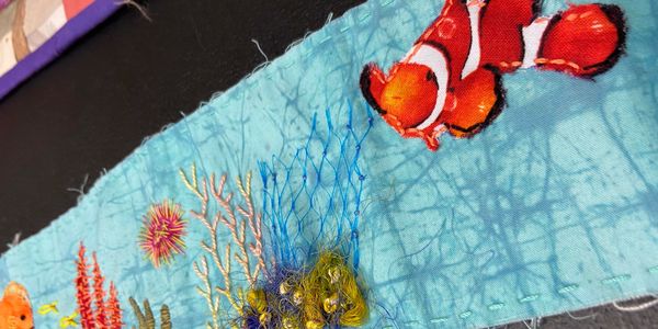 detail of a fabric scroll created by Debbie Ross