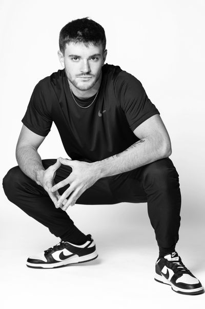 Male model wearing Nike, posing confidently during his modeling photoshoot with NY Model Photography