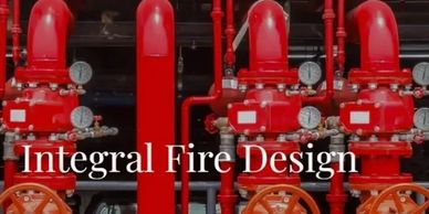 Red fire sprinkler system pipes and gauges in a mechanical room.
