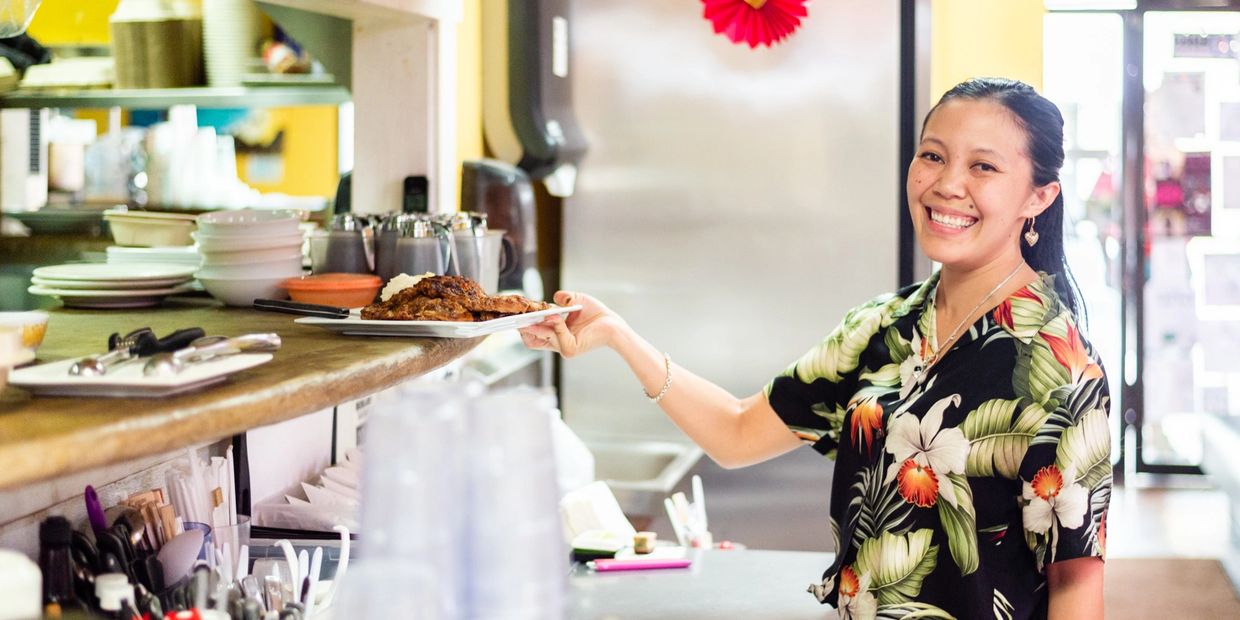 a woman holding a plate of food