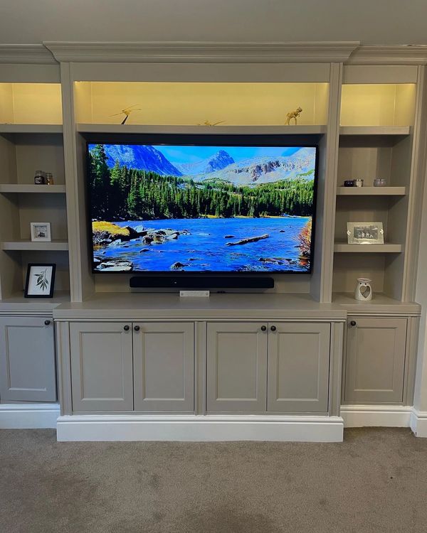 A custom built media wall unit, with top shelf mood lighting.