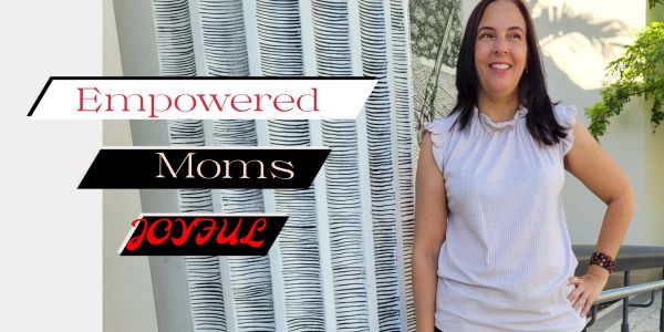Smiling woman stands confidently beside a modern art piece with empowering text.