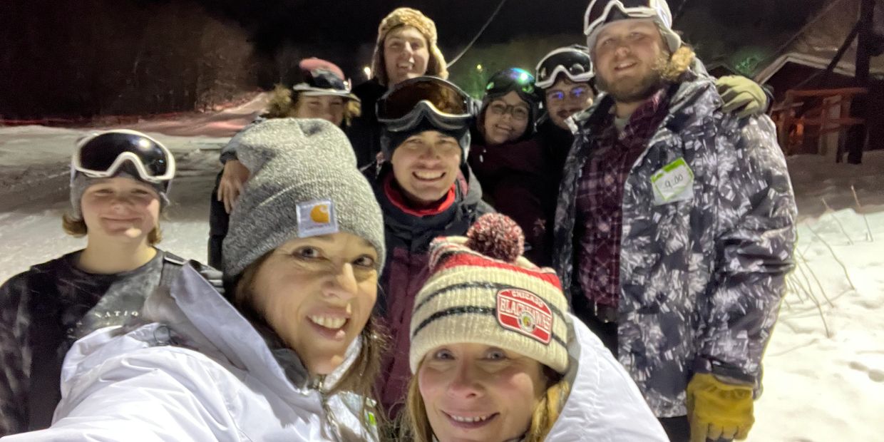 Paws & Pines  team standing at top of Mt. Zion Tubing Hill