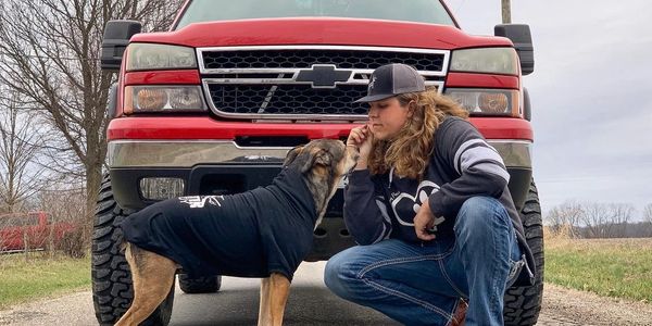 Paws & Pines team member Tyler with Dog Kingsley