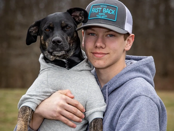 Paws and Pines team member Jaxson with his dog Nellie