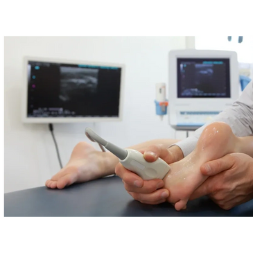 Physiotherapist uses diagnostic ultrasound on a patient's foot.