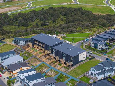 Residential houses with green surroundings.