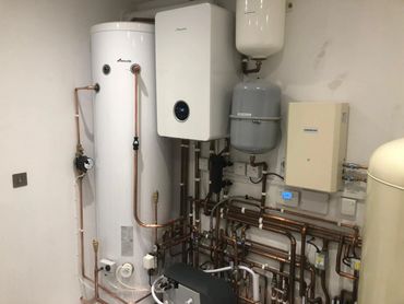 Boiler house installed by us with a hot water cylinder, boiler and many more parts