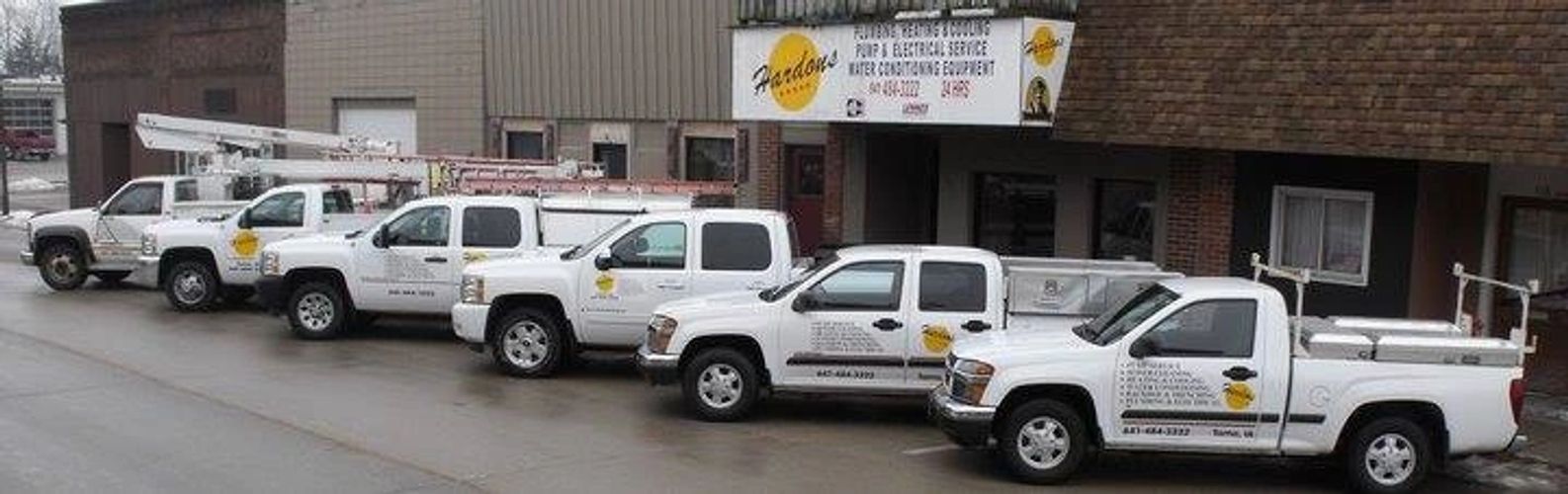 Hardon's storefront and service fleet in downtown Tama, Iowa