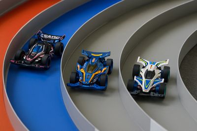Three tamiya mini 4wd cars in tamiya mini 4wd racing track