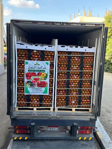 Truck loaded with crates of dates ready for delivery.