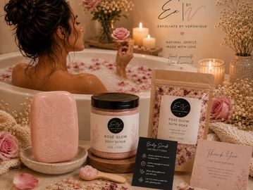 A relaxing rose-themed bath setup with candles and skincare products.