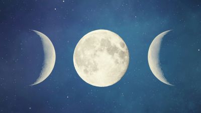 Phases of the moon against a starry night sky.