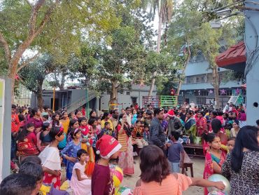 Crowd of people at a festive outdoor event.