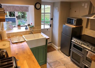 Well appointed cottage kitchen, leading out to the courtyard.