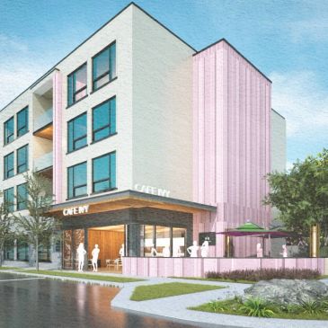Modern four-story building featuring a café with outdoor seating and pink architectural accents.