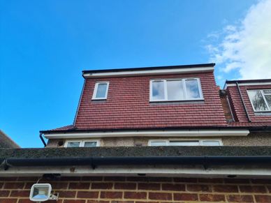 Dormer loft conversion with tile-hung cladding completed in Hounslow, West London