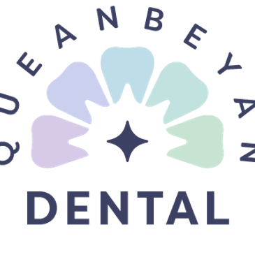 Colorful dental logo with teeth and star design.