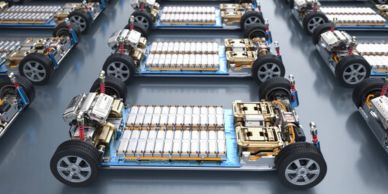Electric vehicle battery packs on chassis frames.