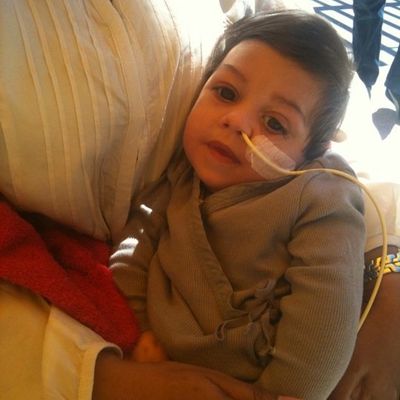 A baby boy with a feeding tube