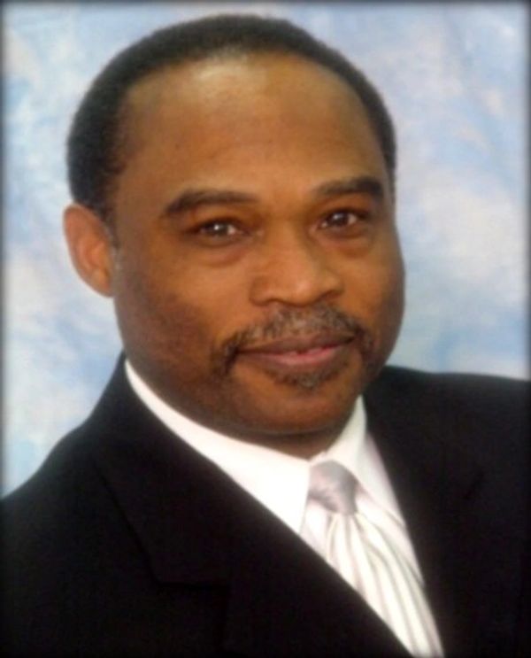 Professional man in a suit with a confident smile.