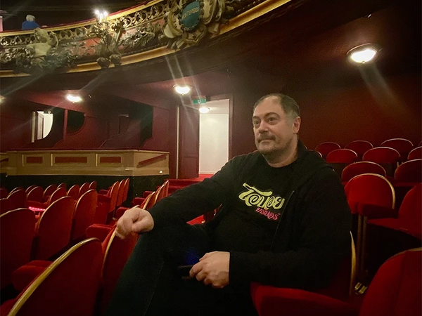 Film director Pascal Adant sitting in a theatre