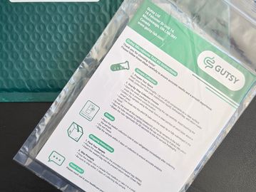 Instruction sheet inside a plastic package with green bubble mailer.