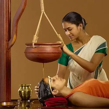 Shirodhara, derived from the Sanskrit words "Shiro" (head) and "Dhara" (flow),