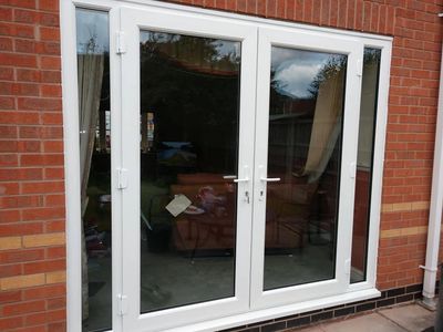 UPVC French Doors with two side panels installed in Grimsby by our trained Mansfield fitters.