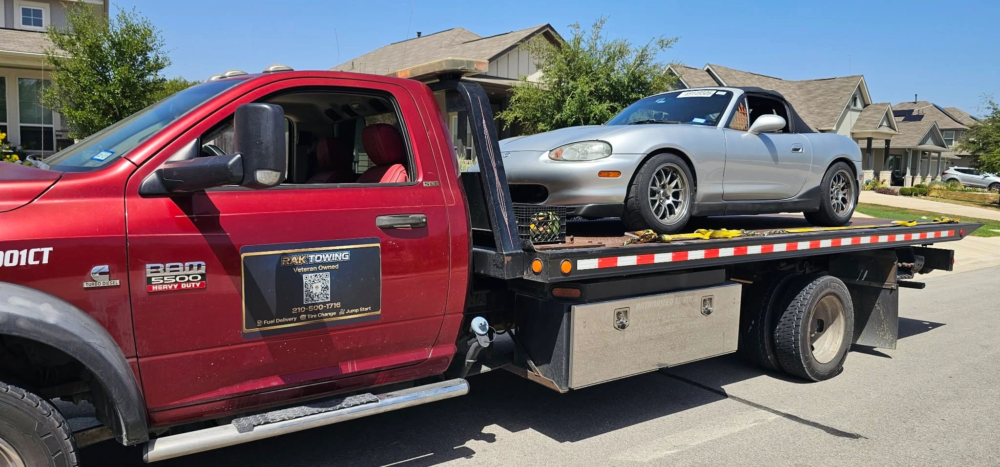 RAK Towing flatbed truck carrying a convertible in New Braunfels
