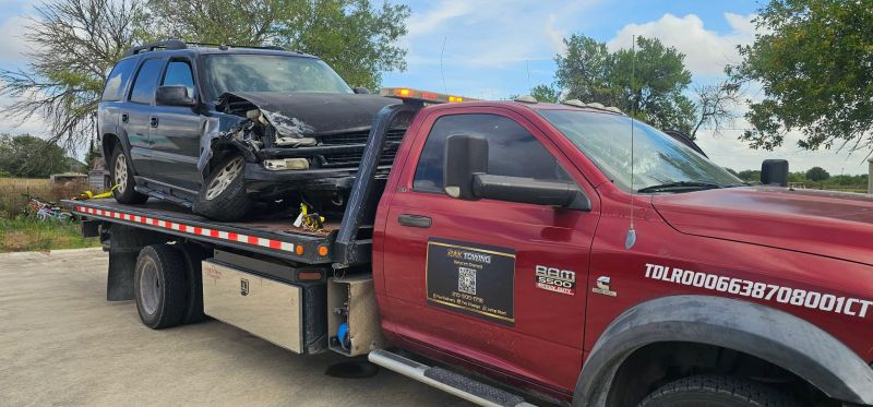 RAK Towing flatbed carrying an SUV