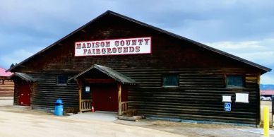 Wooden building labeled Madison County Pheasant Buds.