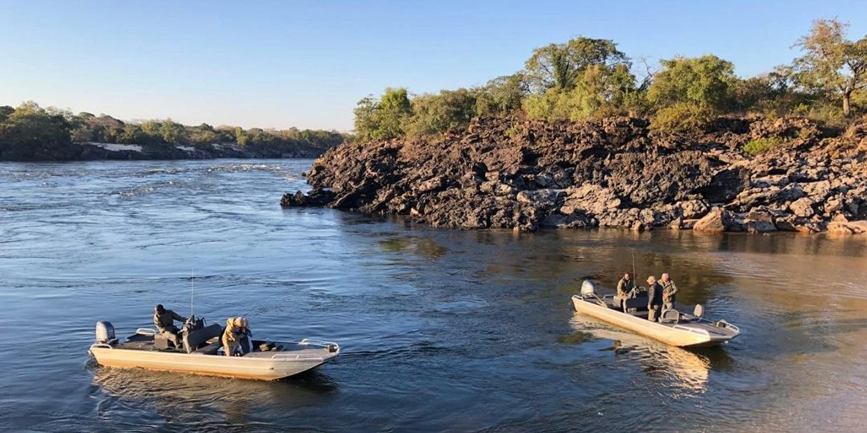 Our boats coming in to camp at Ngonye Falls Fishing Safari