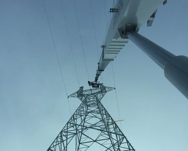 Sky-Hi Crane lifting manbasket 200 feet high on Bipole 3 transmission project. Edmonton Based Crane 