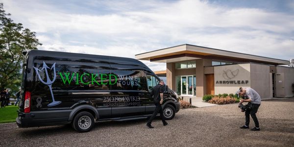 Wicked Wine Tours van parked in front of Arrowleaf Cellars