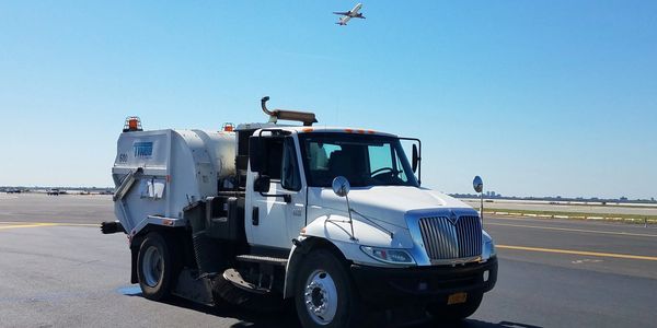 Tymco 600 Regenerative air street sweeping at airport