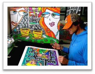 Artist working on colorful pop art paintings.
