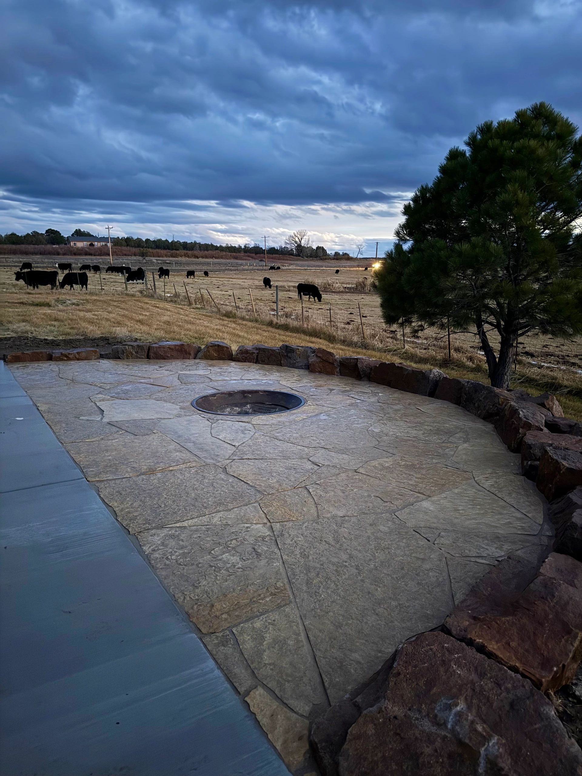 Flagstone Patio, Fire Pit and Moss Rock Install in Farmington, NM By Landscaper in Farmington, NM